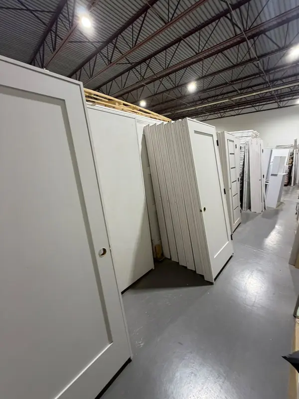 Aisle of pre-hung Shaker doors in the warehouse
